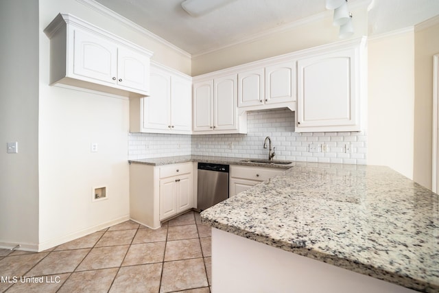 kitchen featuring light tile patterned floors, light stone countertops, ornamental molding, a sink, and stainless steel dishwasher