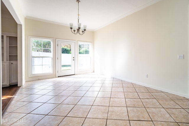 spare room featuring light tile patterned floors, baseboards, a notable chandelier, and crown molding