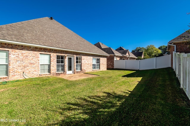 view of yard featuring a fenced backyard