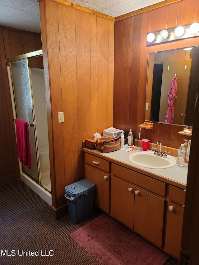 112 Lott Rd, Perkinston, MS 39573 - full bath featuring a stall shower, vanity, and wooden walls