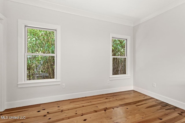 1309 Bowen Ave, Ocean Springs, MS 39564 - spare room with healthy amount of natural light, baseboards, and wood finished floors