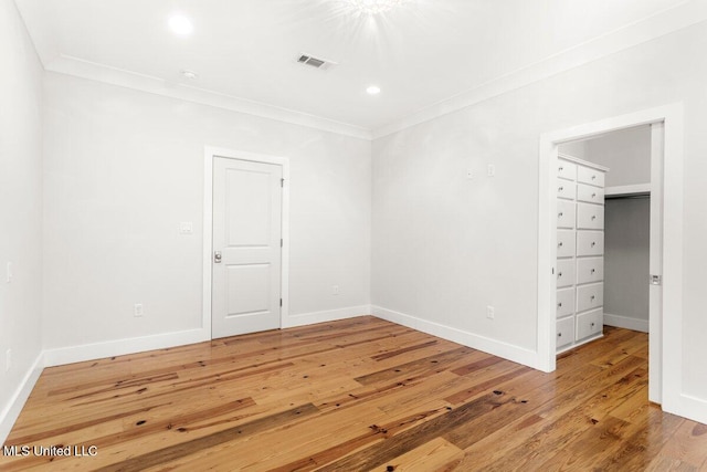 1309 Bowen Ave, Ocean Springs, MS 39564 - empty room featuring crown molding, light wood-style floors, baseboards, and recessed lighting