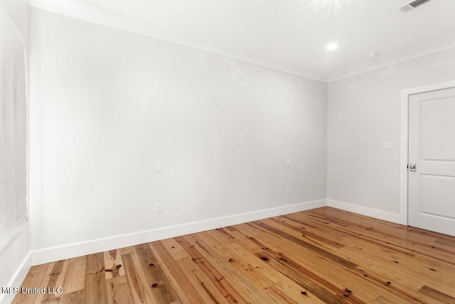 1309 Bowen Ave, Ocean Springs, MS 39564 - spare room with baseboards, light wood-style floors, ornamental molding, and recessed lighting