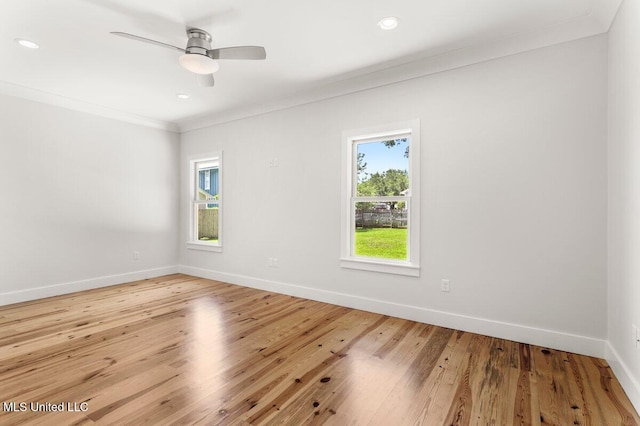 1309 Bowen Ave, Ocean Springs, MS 39564 - empty room featuring crown molding, baseboards, wood finished floors, ceiling fan, and recessed lighting