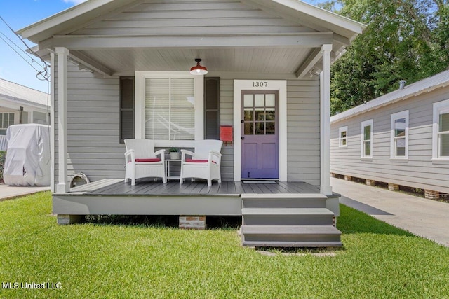 1309 Bowen Ave, Ocean Springs, MS 39564 - entrance to property featuring a yard and covered porch