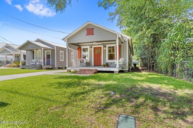 1309 Bowen Ave, Ocean Springs, MS 39564 - view of front of house with a porch and a front lawn