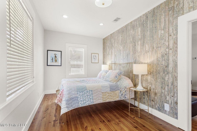 1309 Bowen Ave, Ocean Springs, MS 39564 - bedroom with wood finished floors, baseboards, and recessed lighting