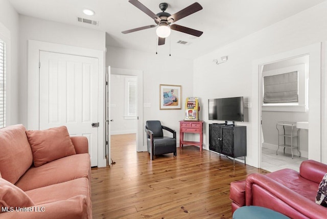 1309 Bowen Ave, Ocean Springs, MS 39564 - living area featuring ceiling fan, light wood-type flooring, baseboards, and recessed lighting