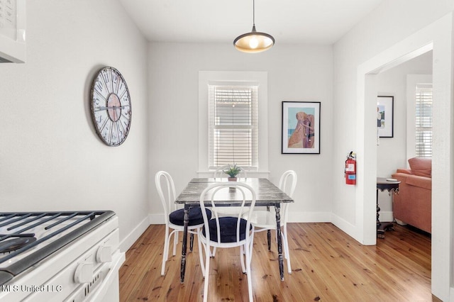 1309 Bowen Ave, Ocean Springs, MS 39564 - dining room with light wood-style floors and baseboards