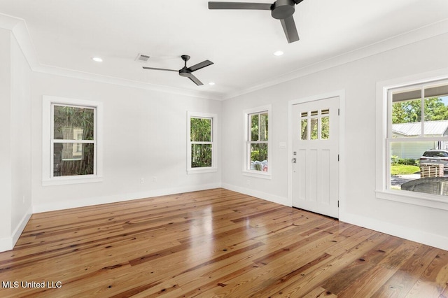1309 Bowen Ave, Ocean Springs, MS 39564 - entrance foyer with a ceiling fan, crown molding, wood-type flooring, plenty of natural light, and baseboards