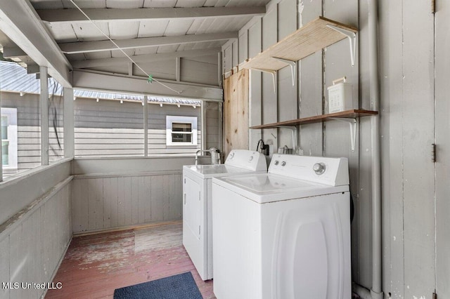 1309 Bowen Ave, Ocean Springs, MS 39564 - washroom featuring washing machine and dryer, light wood finished floors, and wood walls
