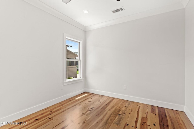 1309 Bowen Ave, Ocean Springs, MS 39564 - empty room with baseboards, crown molding, light wood-style floors, and recessed lighting
