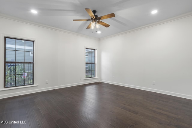 empty room featuring ceiling fan, dark wood-type flooring, and ornamental molding