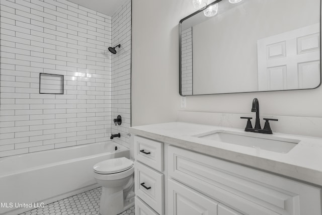 full bathroom featuring vanity, toilet, and tiled shower / bath