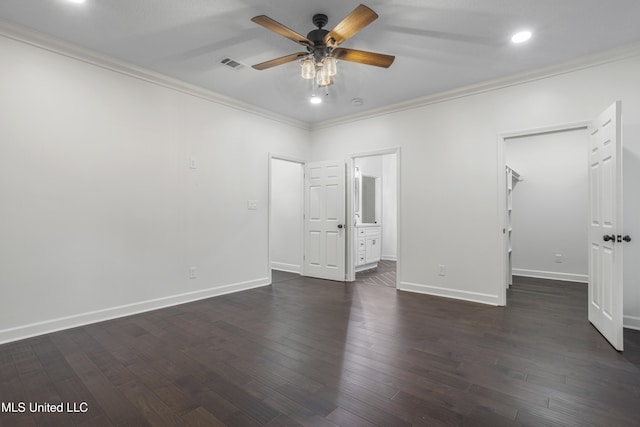 unfurnished bedroom with ensuite bath, ceiling fan, and ornamental molding