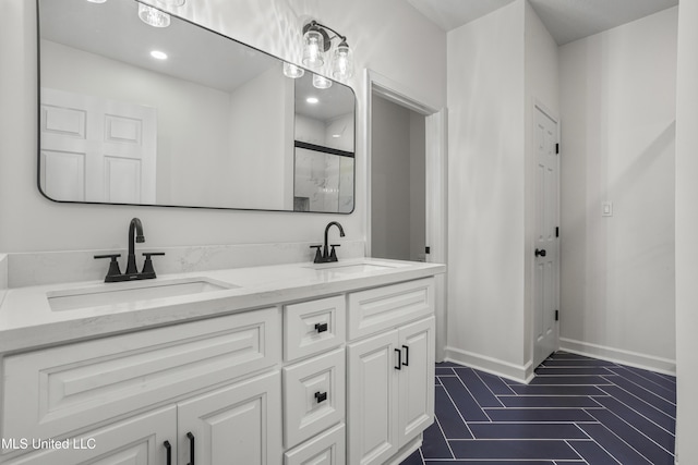 bathroom with vanity and a shower with shower door