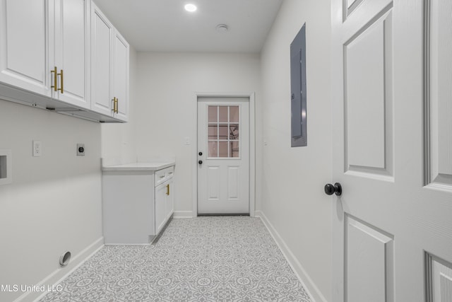 laundry room featuring hookup for an electric dryer and cabinets