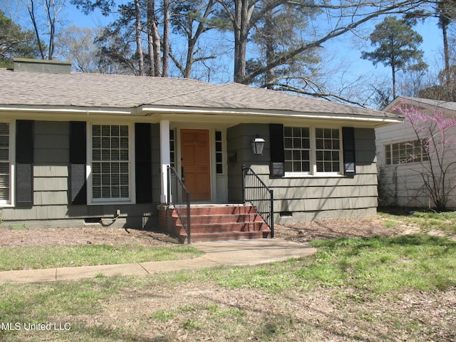 ranch-style house with roof with shingles and crawl space