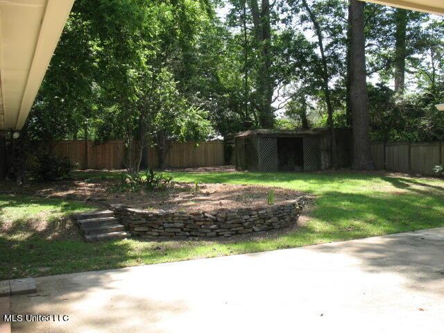 view of yard featuring a patio and a fenced backyard