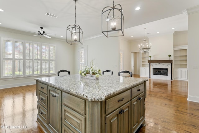 117 Belle Ct, Madison, MS 39110 - kitchen featuring ceiling fan, a premium fireplace, open floor plan, ornamental molding, and recessed lighting