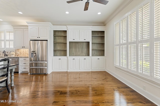 117 Belle Ct, Madison, MS 39110 - kitchen featuring stainless steel appliances, plenty of natural light, ceiling fan, white cabinets, and ornamental molding