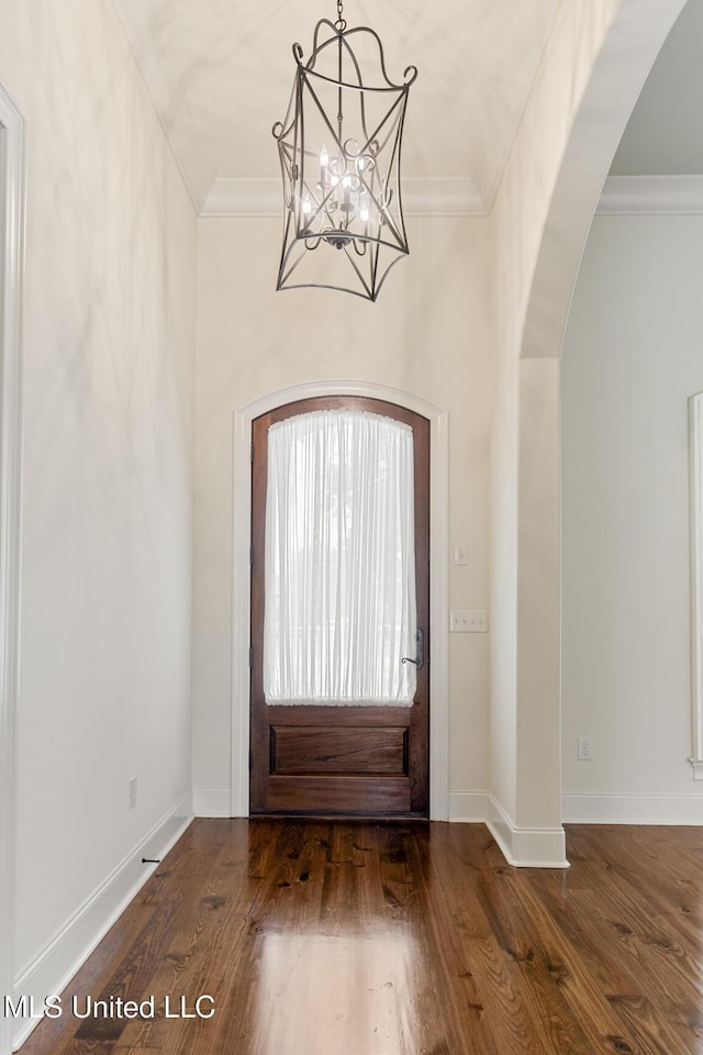 117 Belle Ct, Madison, MS 39110 - entrance foyer with arched walkways, wood finished floors, a chandelier, and crown molding