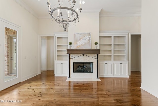 117 Belle Ct, Madison, MS 39110 - unfurnished living room with a chandelier, ornamental molding, a fireplace, and wood finished floors