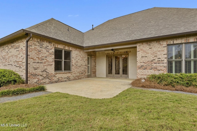 117 Belle Ct, Madison, MS 39110 - back of property featuring a lawn, brick siding, roof with shingles, a patio area, and ceiling fan