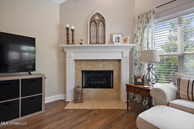1510 Independence Blvd, Flowood, MS 39232 - living area featuring wood finished floors, a tile fireplace, and baseboards