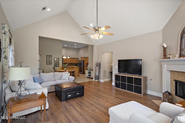 1510 Independence Blvd, Flowood, MS 39232 - living area with wood finished floors, high vaulted ceiling, a ceiling fan, a chandelier, and a fireplace