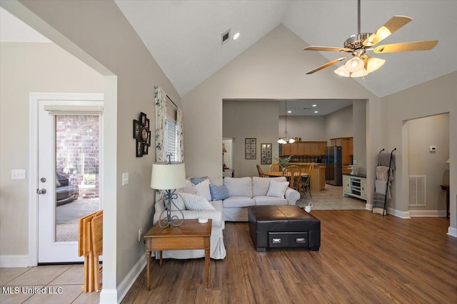1510 Independence Blvd, Flowood, MS 39232 - living room featuring light wood-type flooring, high vaulted ceiling, a ceiling fan, a chandelier, and baseboards