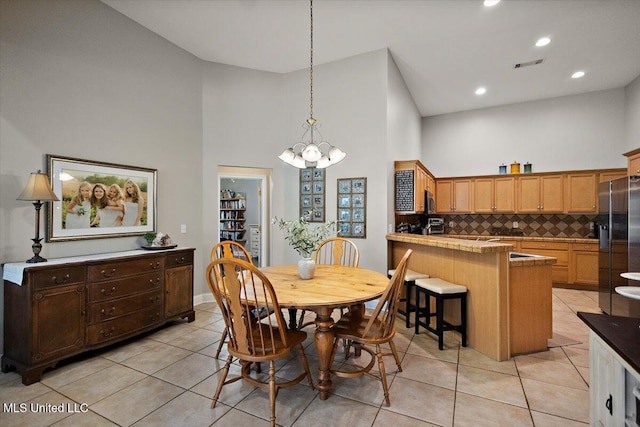 1510 Independence Blvd, Flowood, MS 39232 - dining space featuring high vaulted ceiling, a chandelier, light tile patterned floors, and recessed lighting