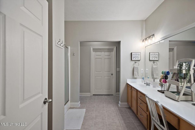 1510 Independence Blvd, Flowood, MS 39232 - bathroom with vanity, tile patterned floors, baseboards, and a shower with shower door
