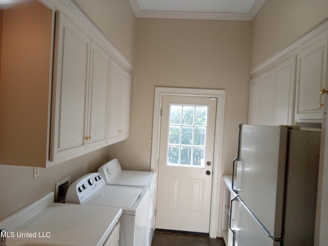 103 Park Ave, Indianola, MS 38751 - washroom with cabinets, washer and dryer, and ornamental molding