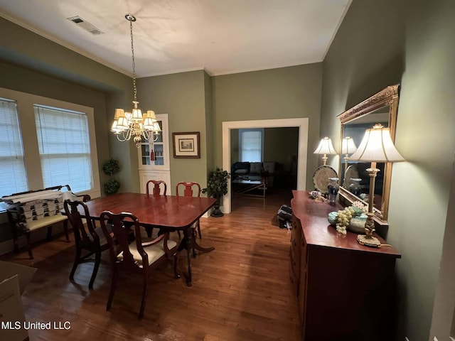 103 Park Ave, Indianola, MS 38751 - dining room with ornamental molding, dark hardwood / wood-style floors, and a notable chandelier