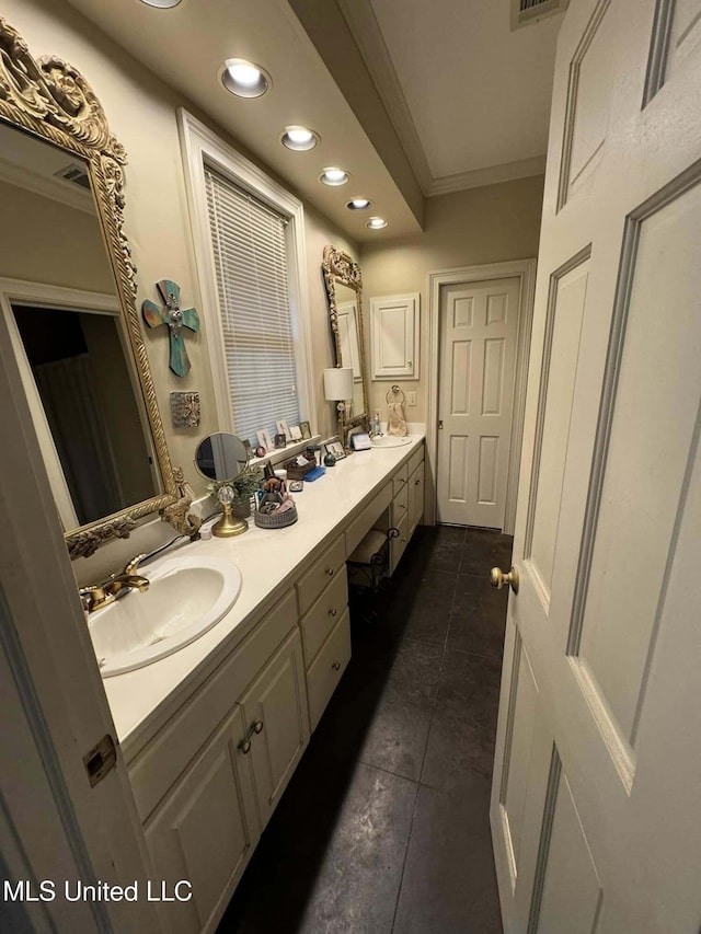 103 Park Ave, Indianola, MS 38751 - bathroom featuring vanity, tile patterned floors, and crown molding