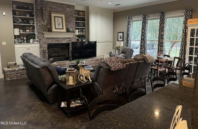 103 Park Ave, Indianola, MS 38751 - living room featuring built in shelves, crown molding, dark tile patterned floors, and a fireplace