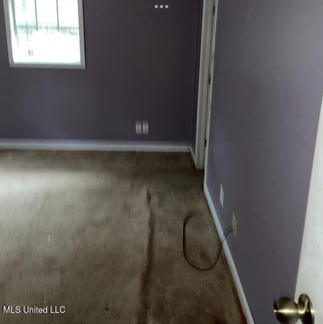 unfurnished room featuring carpet flooring