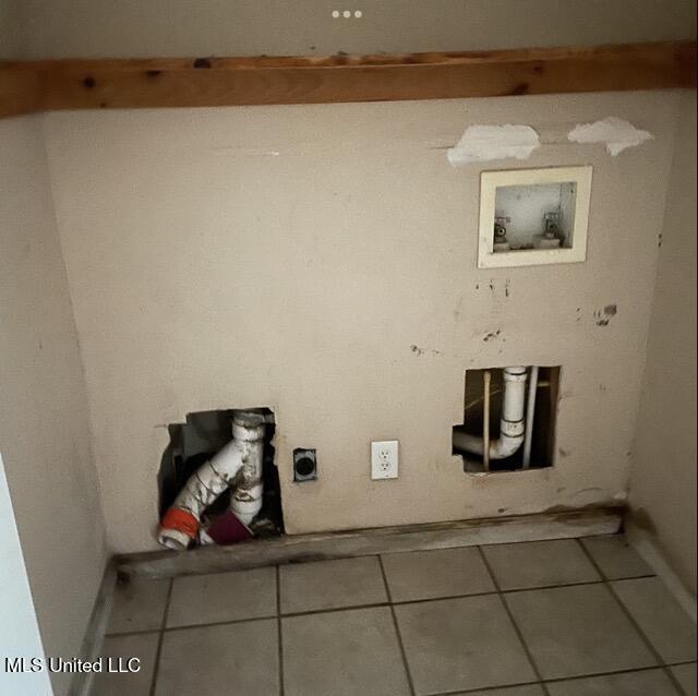 laundry area featuring hookup for a washing machine, tile patterned floors, and electric dryer hookup