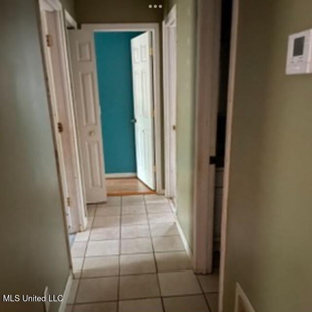 hallway with light tile patterned flooring