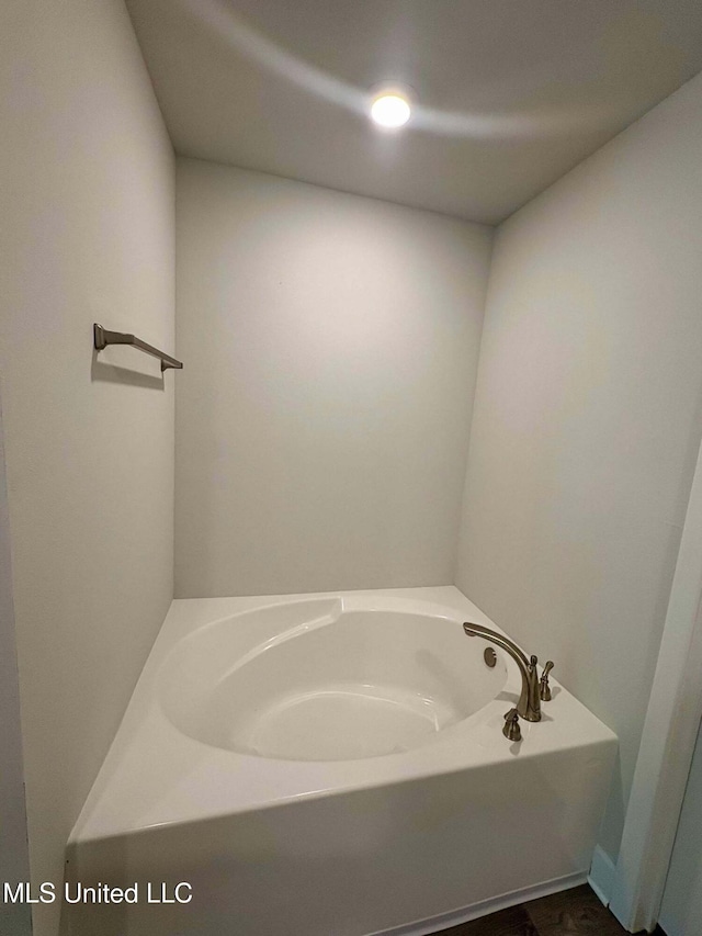 full bath with a garden tub