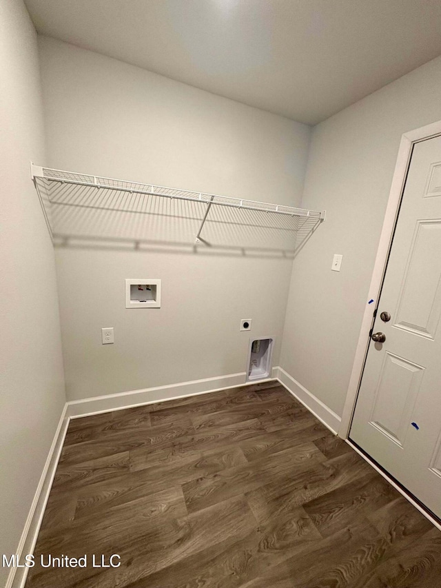 clothes washing area featuring dark wood finished floors, electric dryer hookup, laundry area, and washer hookup