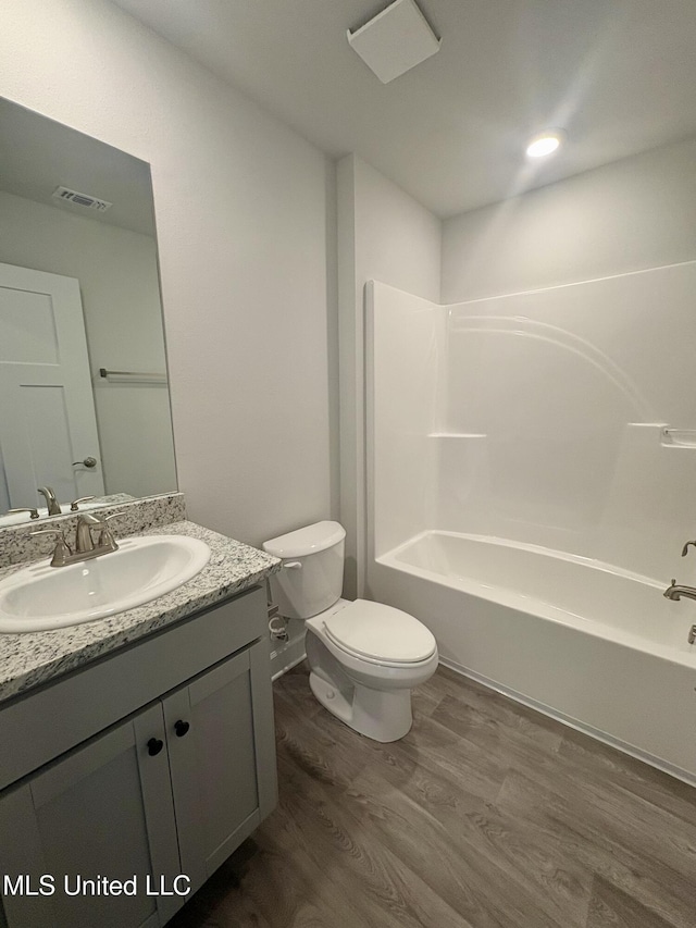 18071 Tiffany Renee Dr, Gulfport, MS 39503 - full bath with vanity, wood finished floors, toilet, and bathing tub / shower combination
