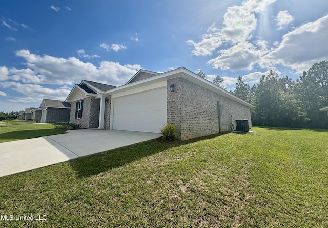 18071 Tiffany Renee Dr, Gulfport, MS 39503 - view of home's exterior featuring brick siding, a lawn, an attached garage, driveway, and central AC