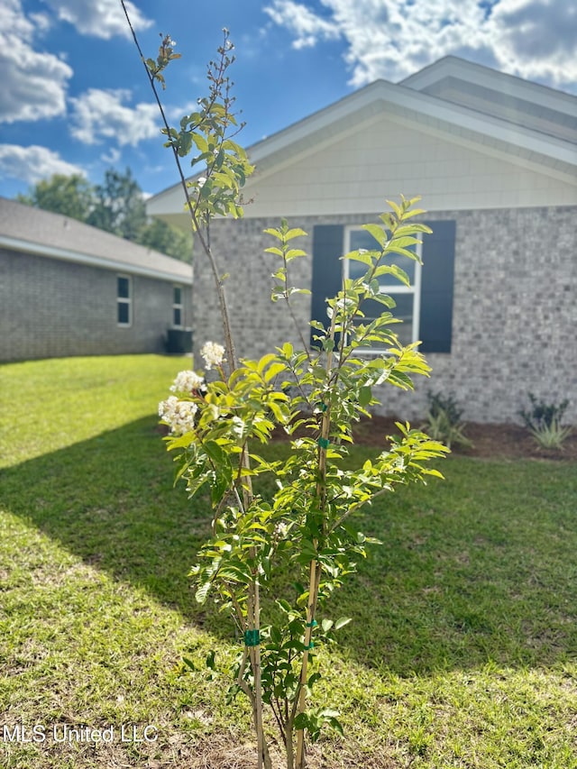 18071 Tiffany Renee Dr, Gulfport, MS 39503 - view of side of property featuring a yard and brick siding