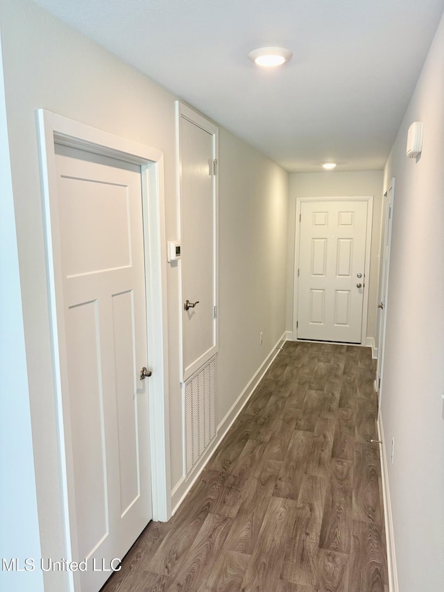 18071 Tiffany Renee Dr, Gulfport, MS 39503 - hallway featuring dark wood finished floors and baseboards