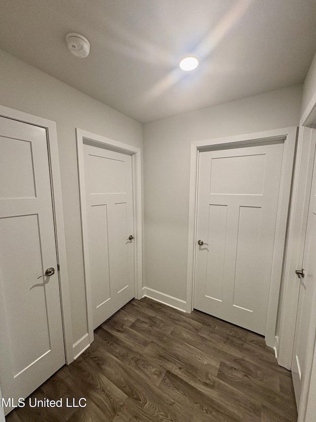 18071 Tiffany Renee Dr, Gulfport, MS 39503 - hall featuring dark wood-style flooring and baseboards