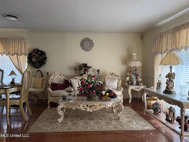 sitting room featuring crown molding and wood finished floors