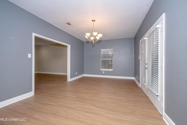 8002 Martin Bluff Rd, Gautier, MS 39553 - unfurnished dining area featuring a chandelier and light wood-style floors