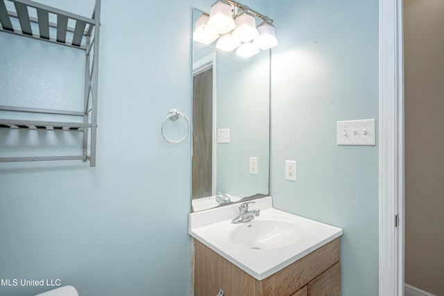 8002 Martin Bluff Rd, Gautier, MS 39553 - half bathroom with vanity and a chandelier